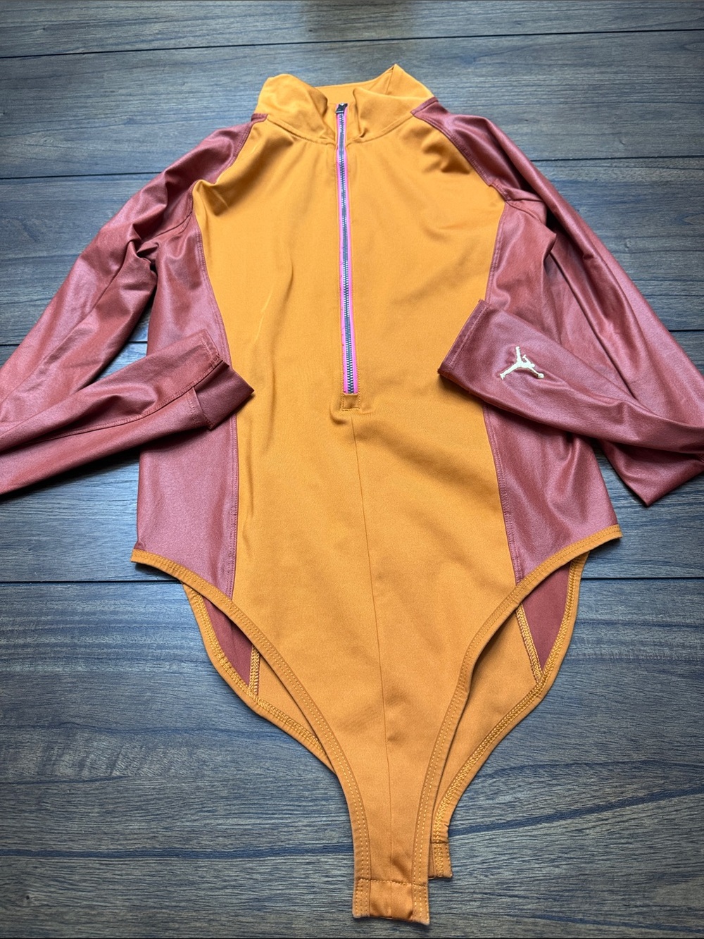 Woman Jordan Orange and Maroon Long-Sleeve One-Piece Bodysuit